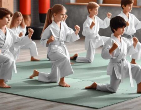 A group of kids practicing Karate in a dojo.