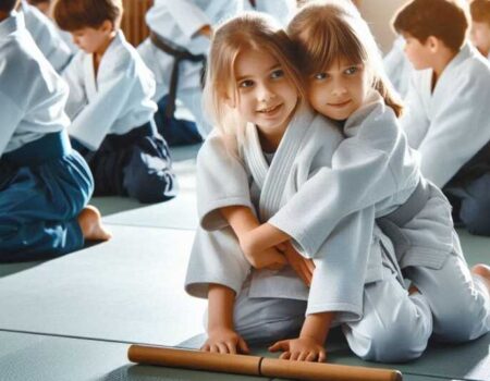 Children practising Aikido martial arts in a dojo