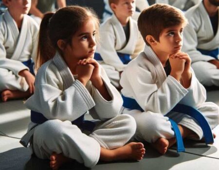 Kids learning Brazilian Jiu-Jitsu in a class.